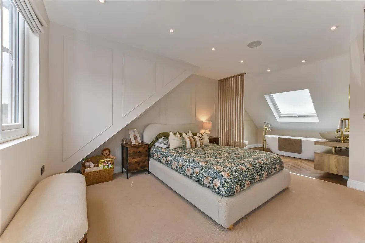 Loft conversion in Portchester, Hampshire — dormer bedroom with freestanding bath